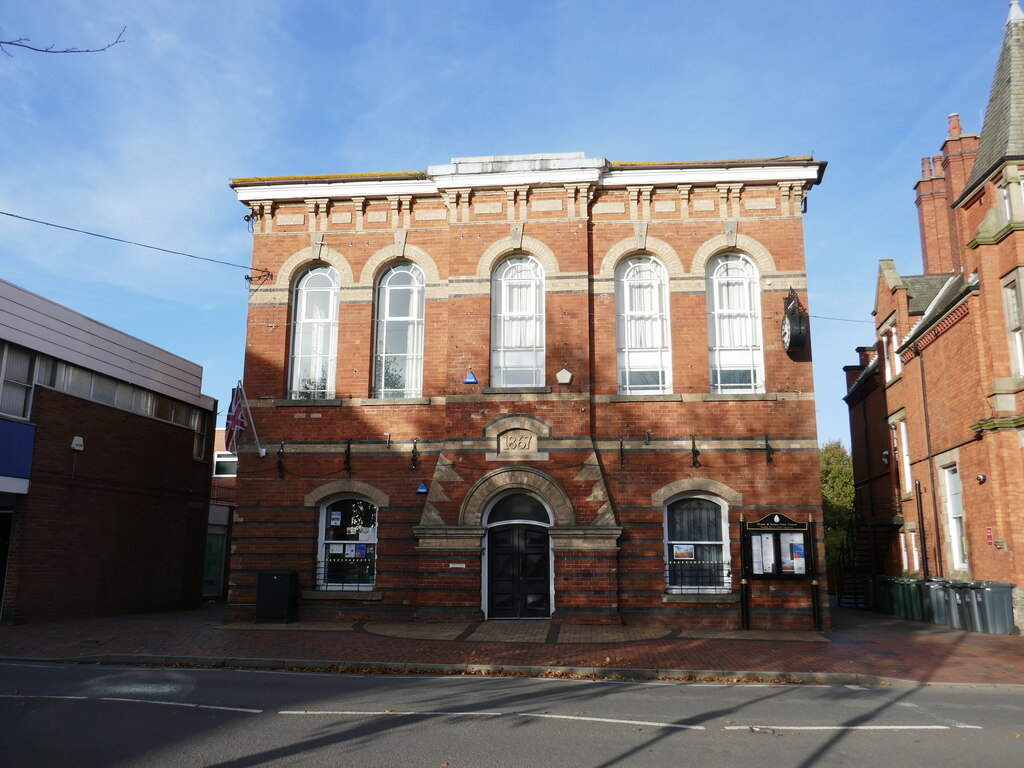 Heanor and Loscoe Town Hall — a red-brick Italianate building with arched first-floor windows and the date 1867 carved above the central doorway
